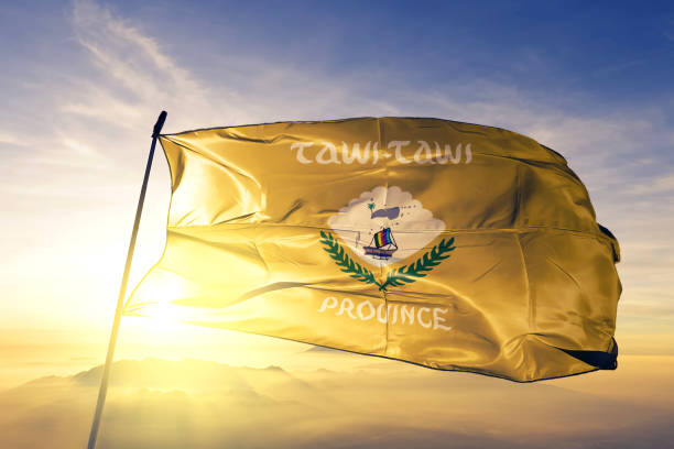 Tawi-Tawi province of Philippines flag textile cloth fabric waving on the top sunrise mist fog Tawi-Tawi province of Philippines flag on flagpole textile cloth fabric waving on the top sunrise mist fog tawi tawi stock pictures, royalty-free photos & images