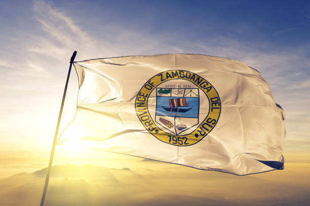 Zamboanga del Sur province of Philippines flag textile cloth fabric waving on the top sunrise mist fog Zamboanga del Sur province of Philippines flag on flagpole textile cloth fabric waving on the top sunrise mist fog zamboanga del sur stock pictures, royalty-free photos & images