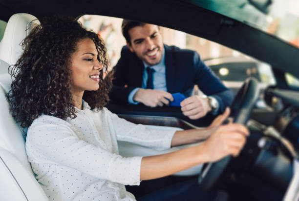 istock Mixed race woman enjoying new car 1086665038