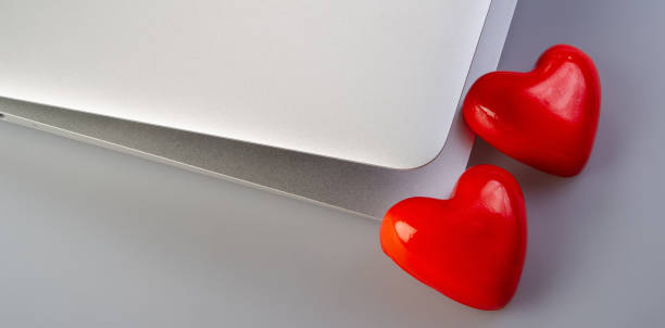istock laptop and hearts lie on the gray background 1086669234