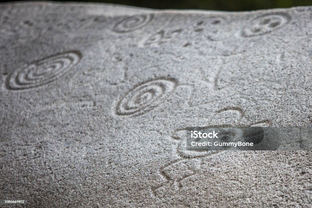 Ancient carved figures on stones in Jayuya Puerto Rico Ancient carved figures Piedra Escrita in Jayuya Puerto Rico Puerto Rico Stock Photo