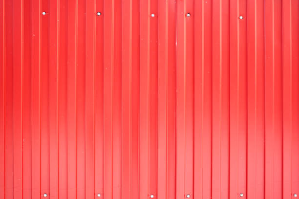 istock Red iron metal sheet with vertical stripes. 1086669860