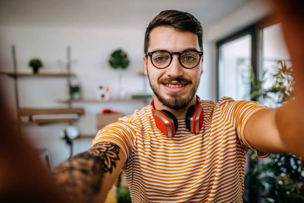 istock Young man takes selfie 1086675180