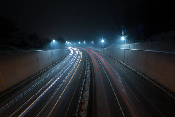 istock turn on the highway at night,Long exposure showing 1086681398
