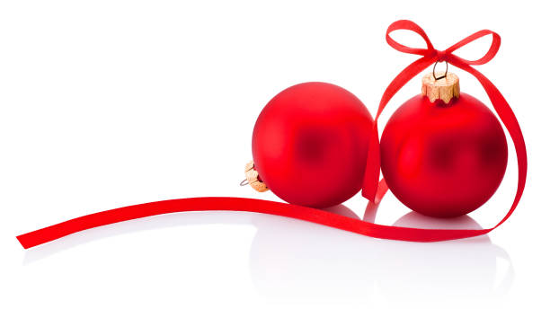 istock Two red Christmas bauble with ribbon bow isolated on white background 1086681890