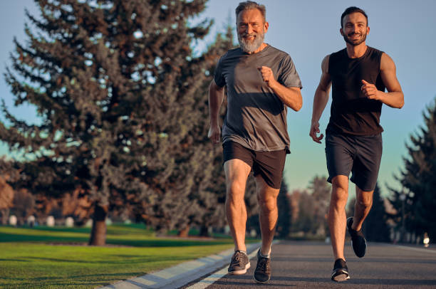 istock The father and son running on the road 1086683336