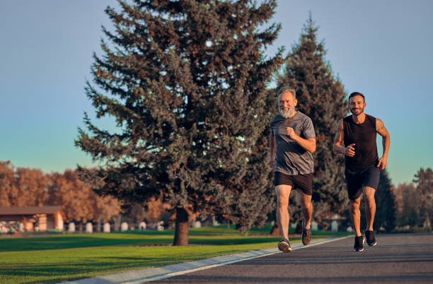 istock The father and son running on the road 1086683350