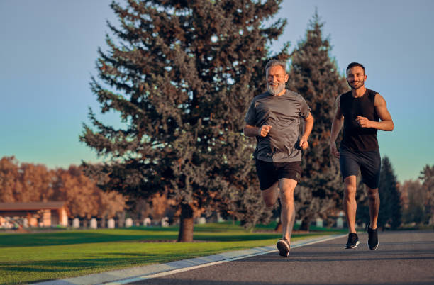 istock The father and son running on the road 1086683358