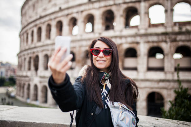 istock Woman taking selfie at colosseo, Rome 1086695348