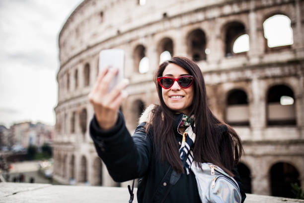 istock Woman taking selfie at colosseo, Rome 1086695352