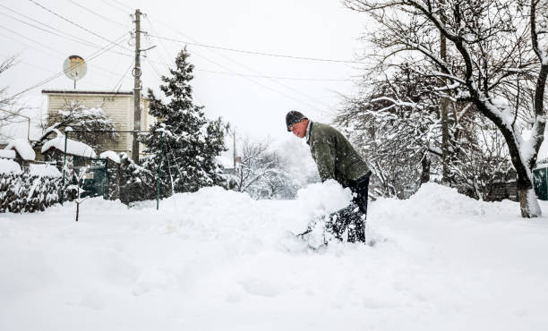 man with a shovel cleans the track from the snow - snow digging horizontal people imagens e fotografias de stock