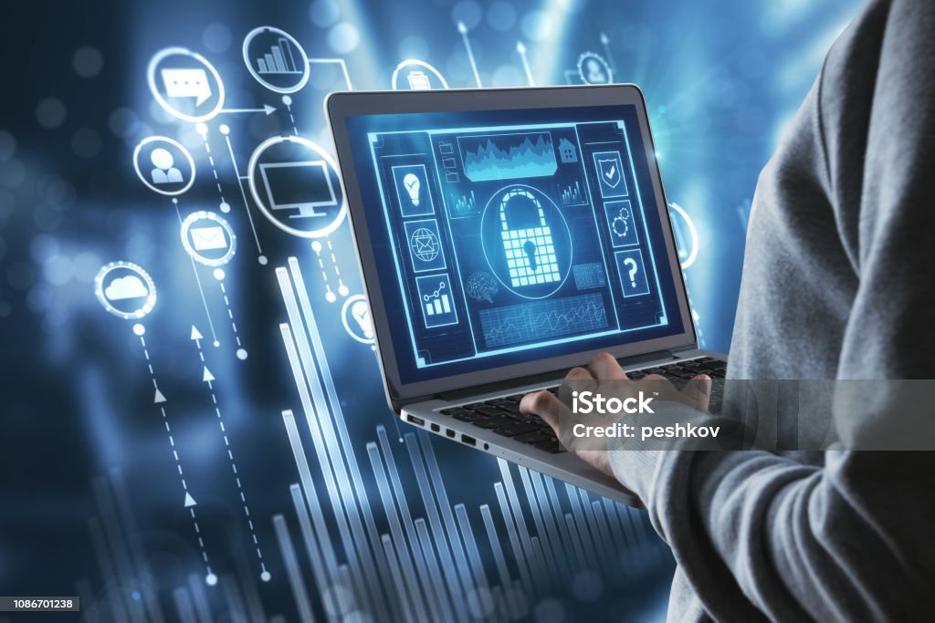 Technology and hud concept Close up of person hand using laptop with digital business interface on blurry interior background. Technology and hud concept Security Stock Photo