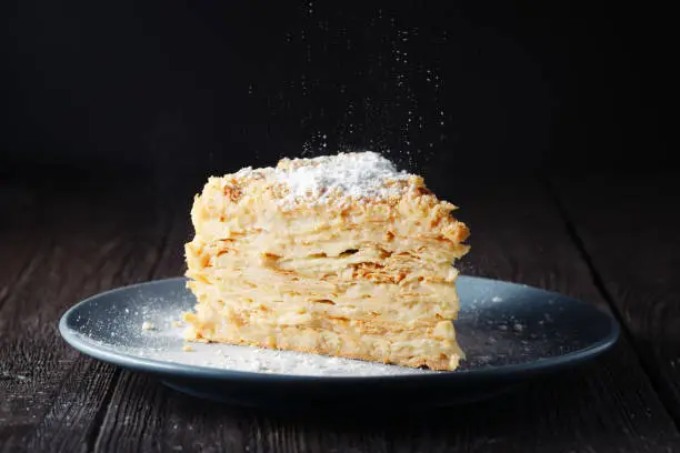 Homemade napoleon cake with cream, millefeuille on a plate