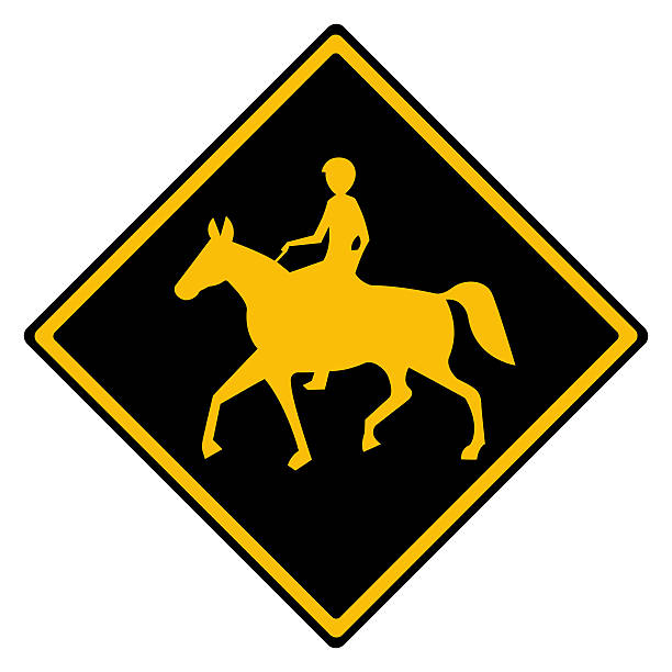 Yellow and black Australian warning road sign Horses crossing in reverse colours, isolated on white background with clipping path