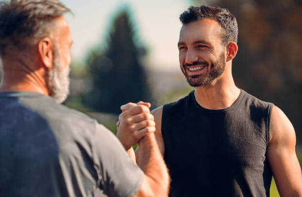 istock The happy son and father greeting outdoor 1086711282