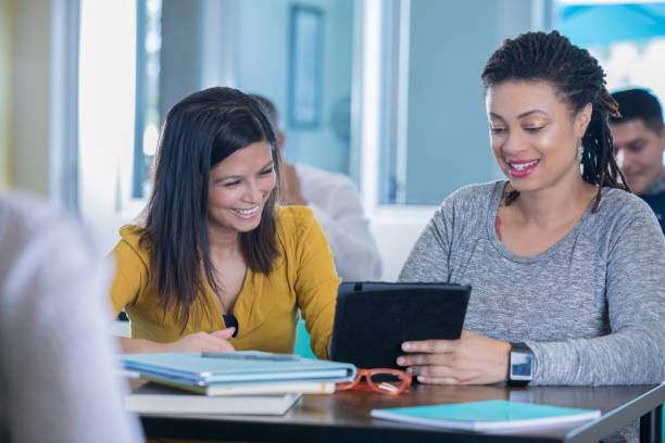 istock Diverse female entrepreneurs are working on business plan in modern open office 1086721314