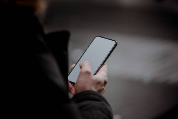 istock Hands of businessman holding a smartphone, Partial view 1086721374
