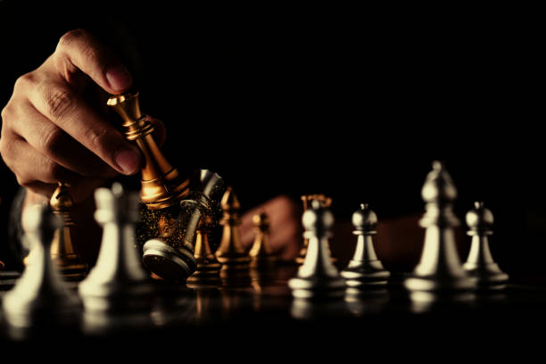 istock businessman hand control chess play figure business strategy manage ideas concept retro image tone 1086725584