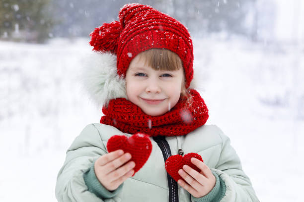 istock A child is showing two small heart. 1086725992
