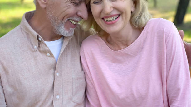istock Elderly couple laughing together, enjoying romantic date, mutual understanding 1086728062
