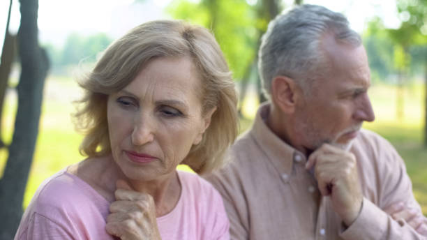 istock Upset wife and husband sitting apart in park, relations problem misunderstanding 1086728388