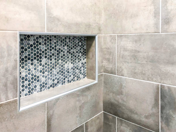 Modern bathroom wall porcelain tiles in gray color tone with custom decorative rectangular wall niche for shampoo and soap