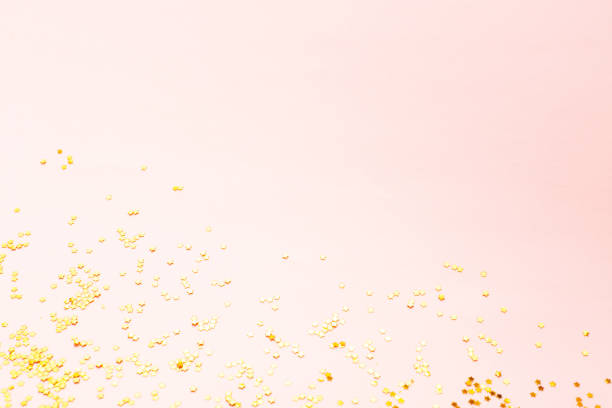 istock Gold color confetti on pink 1086751140