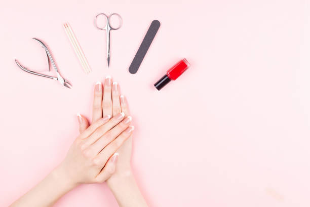 istock French manicure on pink background 1086751302