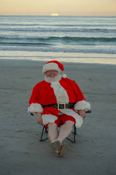 istock Santa Relaxing on the beach 1086755436