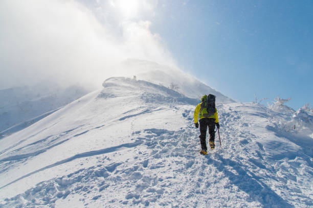 female mountaineer on the snowy slope of Mount Elbrus