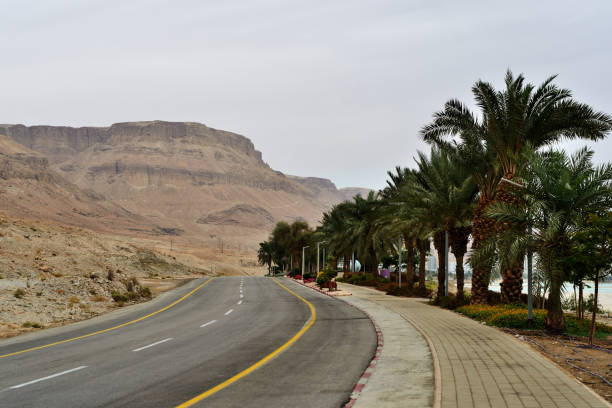 istock Empty road along the mountains on the coast in Israel 1086770602