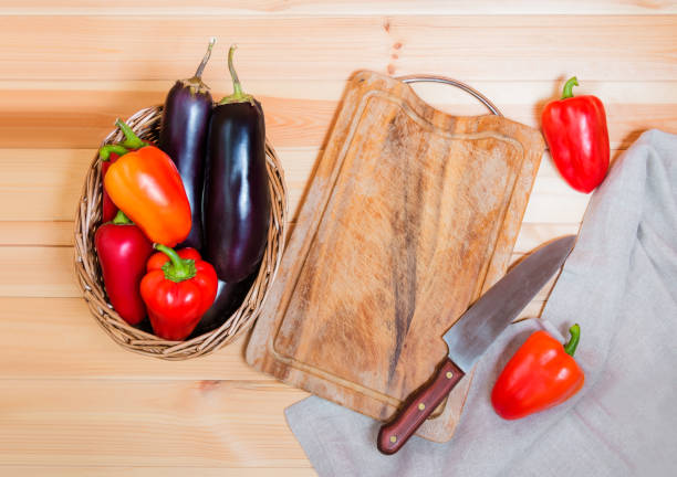 istock Fresh vegetables, cutting board and kitchen knife 1086779612