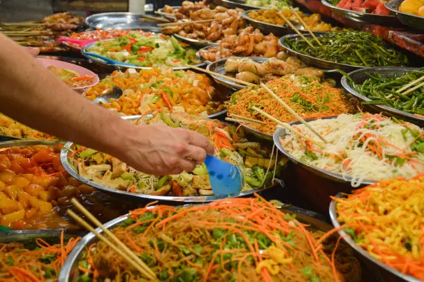 A entire buffet of vegetarian laos food at the walking street market in Luang Prabang night market in Laos