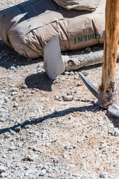istock Cement bag, a hoe and a pick axe 1086787186