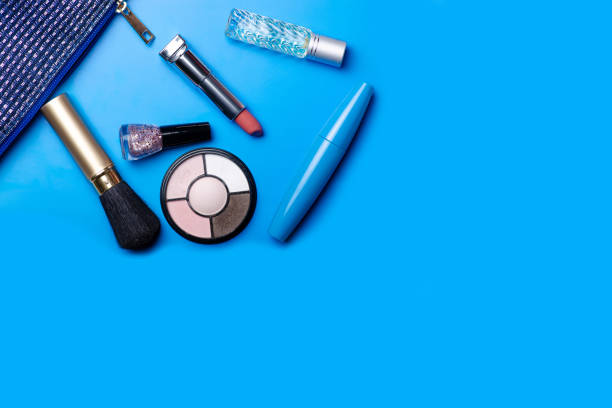Cosmetic bag cosmetics perfume on blue background