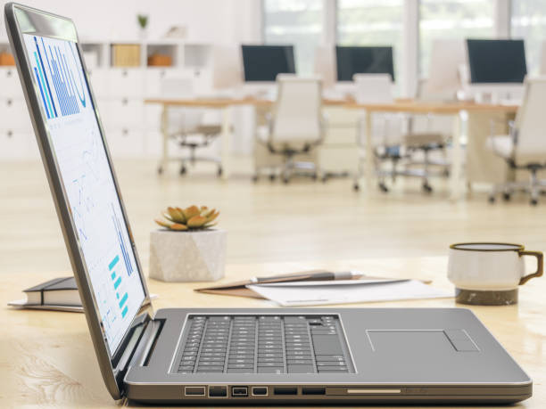istock Laptop on desk and blurred Office 1086801714