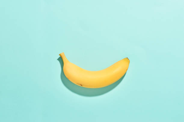 istock Ripe banana isolated on blue background 1086803622