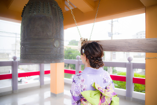 Bronze Buddhist bell hanging in temple, Thailand