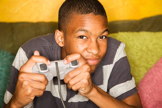 Handsome young man Playing a Video Game with Handheld Controller