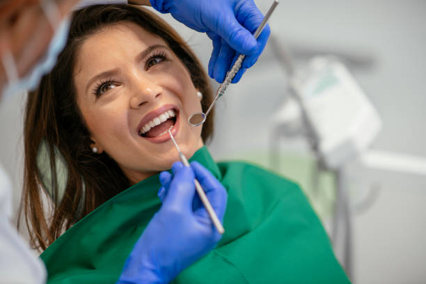 istock Young woman at the dentist 1086815294