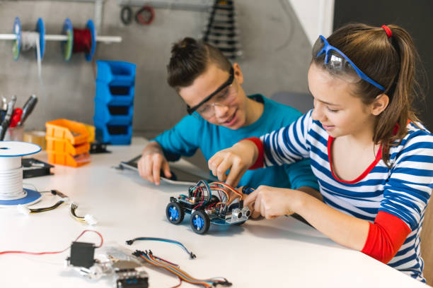 istock Brother and sister working on school project 1086816668