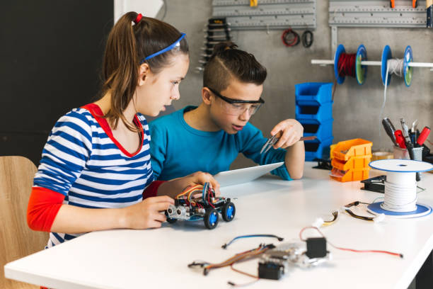 istock Brother and sister working on school project 1086816780