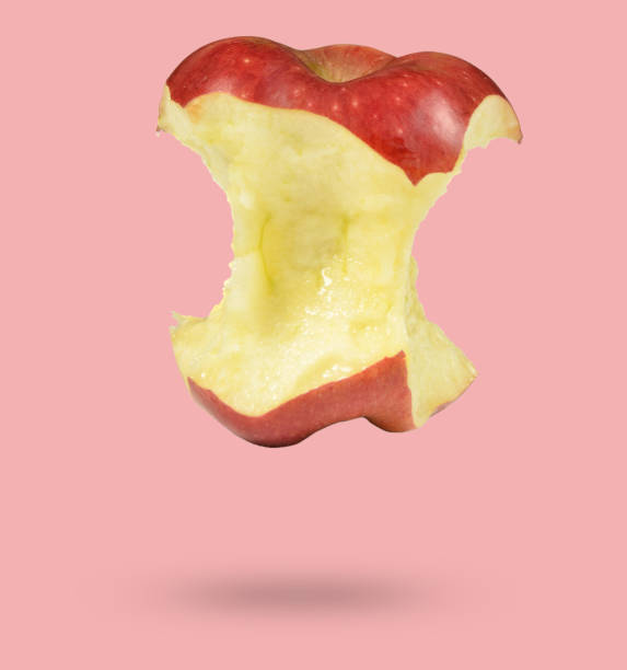 istock Bitten red apple isolated on pink background, minimalism 1086816914