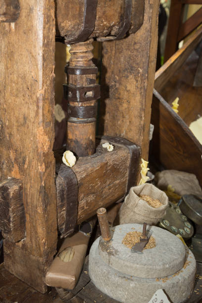 istock Ancient Stone Mill: Manual Grinder Wheel with Crank and Wooden Press for Pasta 1086830320