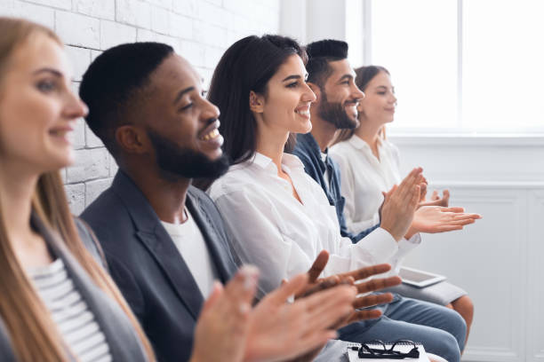 istock Group of businesspeople clapping hands at meeting 1086831920