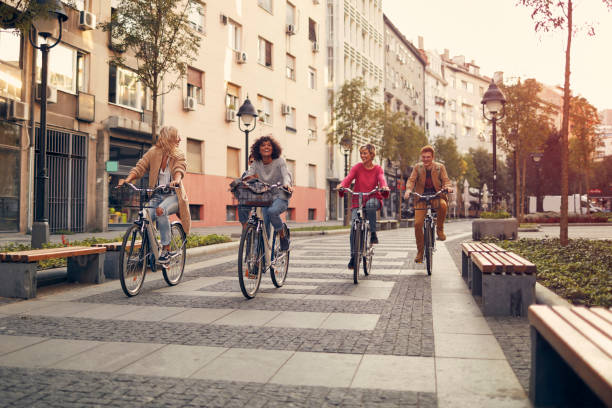 istock Friends Riding Bicycles In A City 1086840926