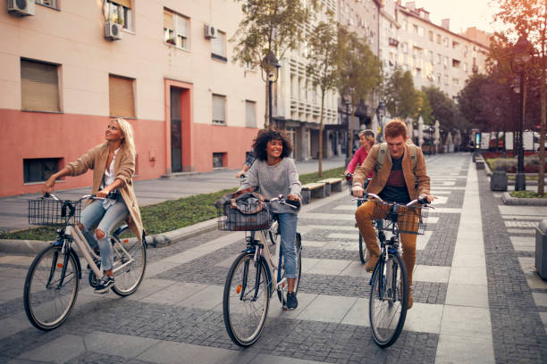 istock Friends Riding Bicycles In A City 1086840932