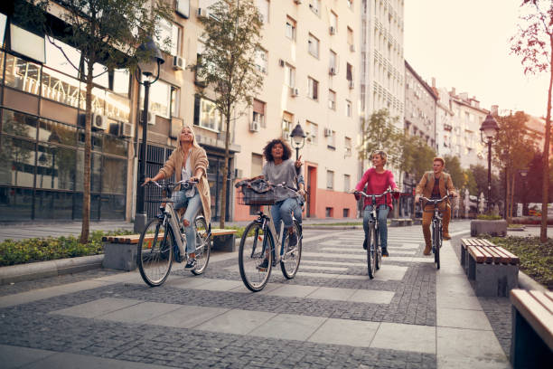 istock Friends Riding Bicycles In A City 1086840962