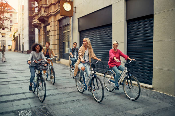istock Friends Riding Bicycles In A City 1086841066