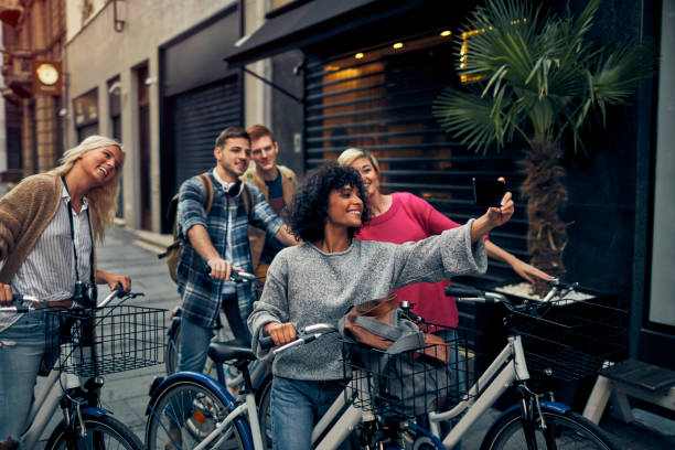 istock Friends Riding Bicycles In A City 1086841126